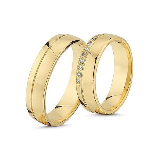 Smukke Nuran vielsesringe i 14 karat guld med 0,11 ct diamanter – klassisk og elegant ringsæt.